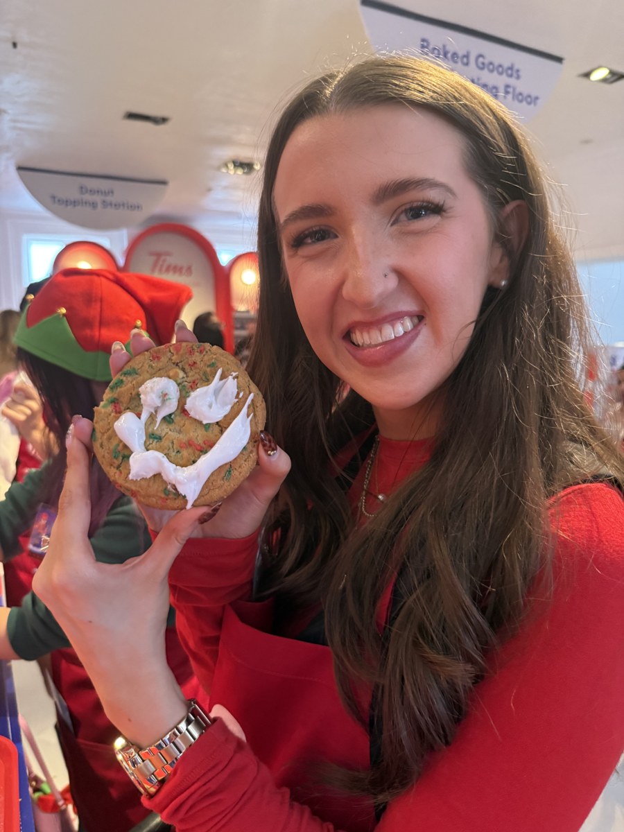 Kale Vine at Tim Hortons Holiday Workshop holding a decorated cookie