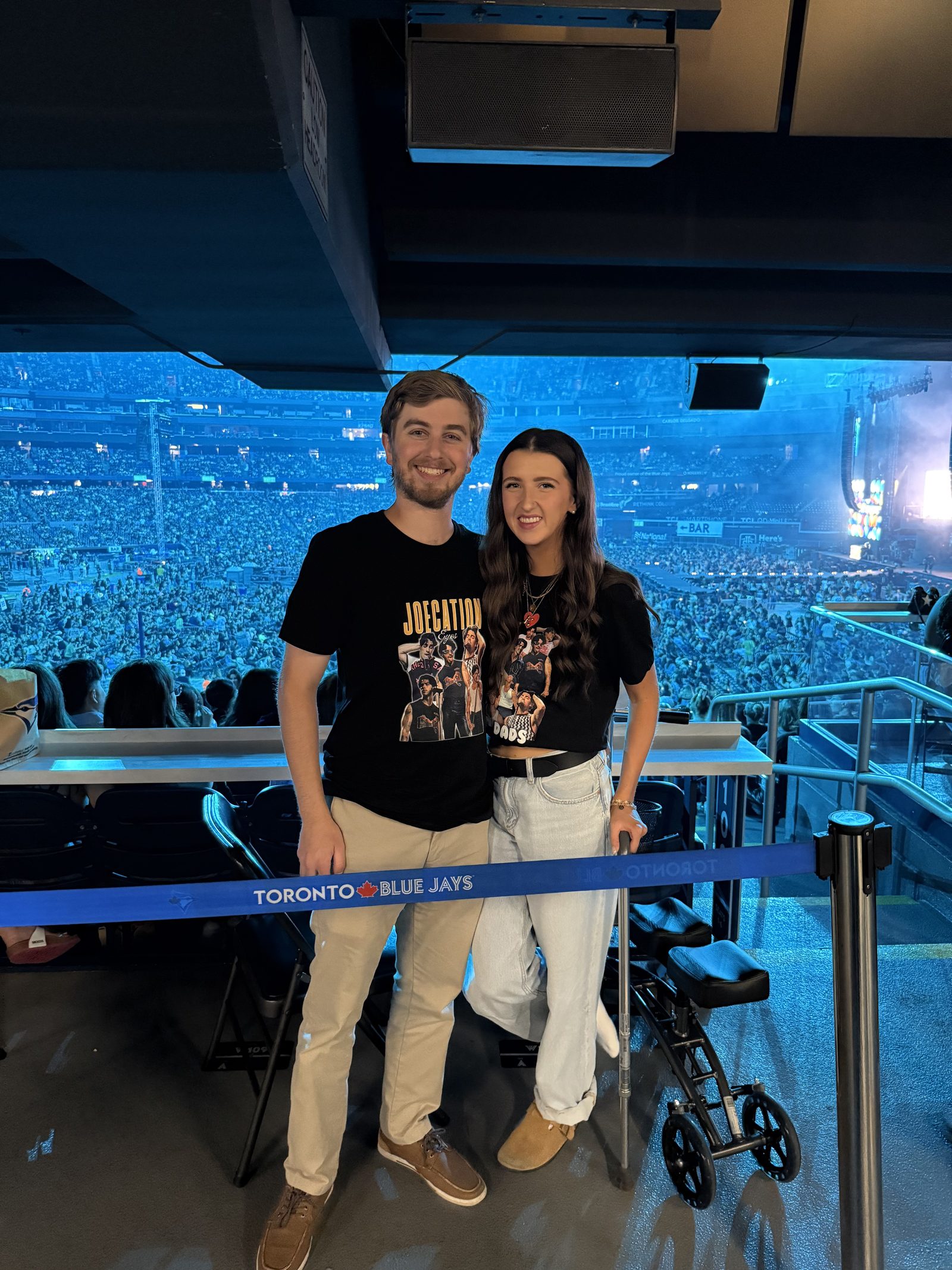 Kale Vine and Nick at a Blue Jays game, smiling together in the stands